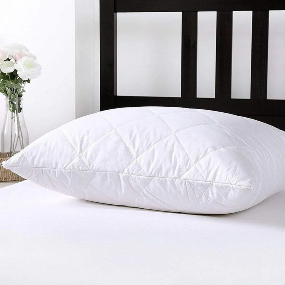 Microfibre shell feather pillow on bed — value line